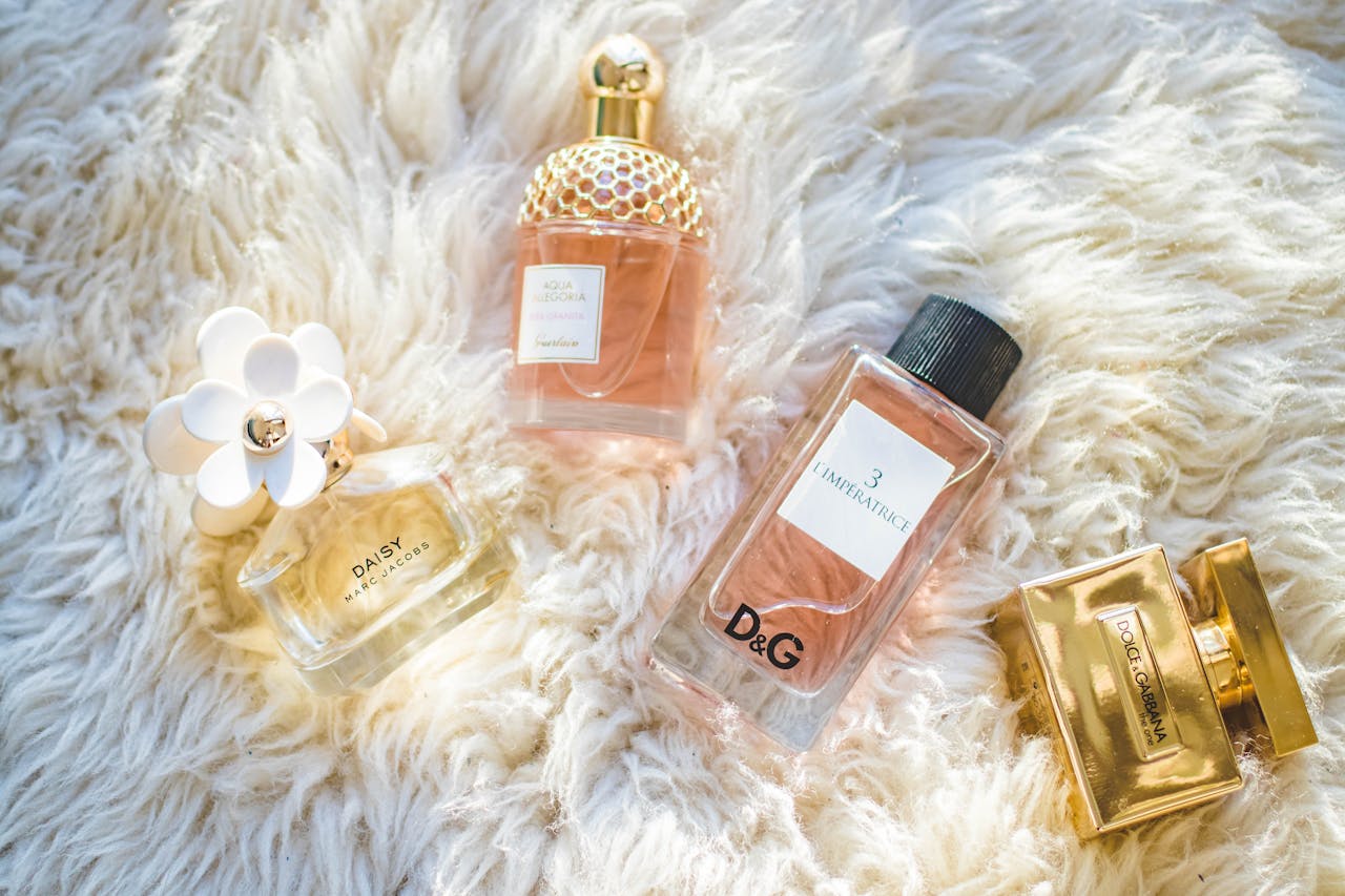 menu-06 Elegant collection of perfume bottles on soft fur, highlighting luxury and style.